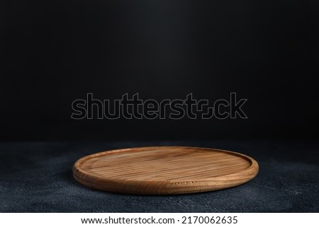 Similar – Image, Stock Photo Food background with empty wooden cutting board, herbs, garlic, olive oil, spices on grey concrete kitchen table. Cooking with fresh, flavorful ingredients. Top view with copy space.