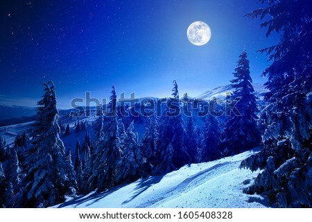 Similar – Foto Bild Vollmond über verschneiten Bergen