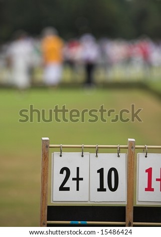 A game of lawn bowls with focus on the scoreboard.