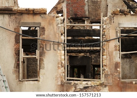 Old historic french stone and wood building after fire damage