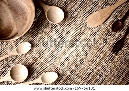 Background of cups and spoons made Ã?Â¢??Ã?Â¢??of wood.