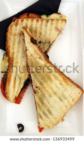 Fast food, toast sandwich with ham and vegetables/Toasted sandwich