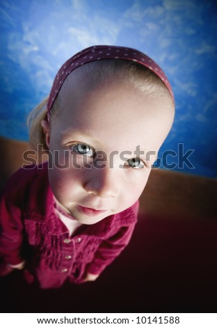 Little girl\'s face distorted in a wide angle lens shot