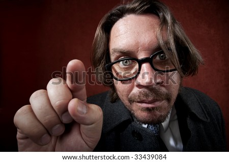 Portrait of worried rugged man with glasses making a funny face