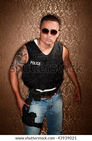 Police Officer with Gun Strapped to His Thigh