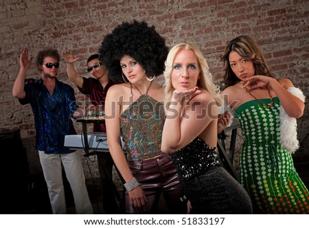Ladies in Retro clothing at a 1970s Disco Music Party
