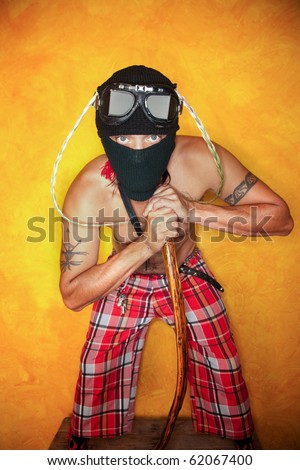Strange man with knit mask and plaid pants