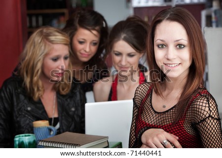 Young woman with three friends take a break from studying