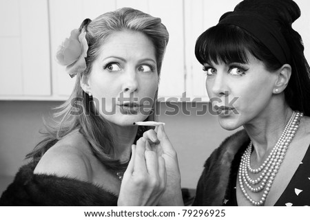 Sneaky rich housewives share a marijuana joint in kitchen