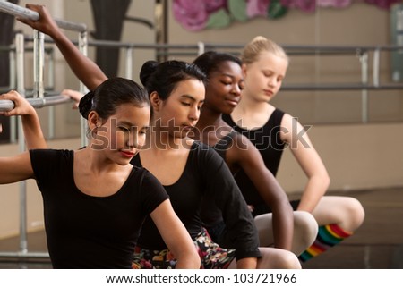 Similar – Foto Bild Ballerina-Tänzerin beim Aufwärmen des flexiblen Körpers im sonnigen Studio.