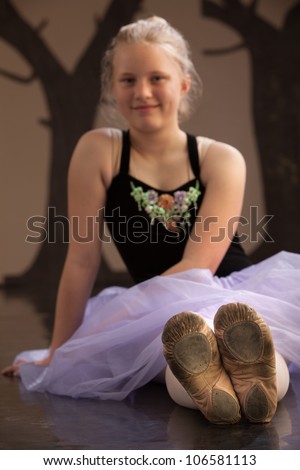 Worn out shoes of a ballet student. Shoes in focus
