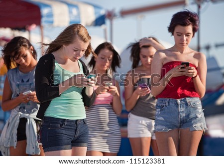 Similar – Image, Stock Photo Stylish teenagers using smartphone outdoors