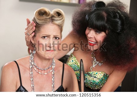 Angry white female with problem hairdo and comforting friend
