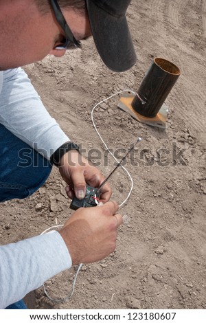 Pyrotechnic expert setting up remote control device