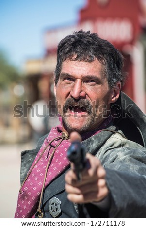 Screaming Cowboy Aims Gun at You