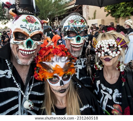 TUCSON, AZ/USA - NOVEMBER 09: Four unidentified people in masks at the All Souls Procession on November 09, 2014 in Tucson, AZ, USA.