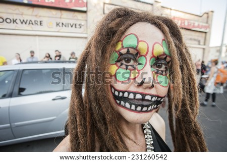 TUCSON, AZ/USA - NOVEMBER 09: Unidentified young woman with dreadlocks facepaint at the All Souls Procession on November 09, 2014 in Tucson, AZ, USA.