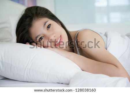 Beautiful young women sleep on bed