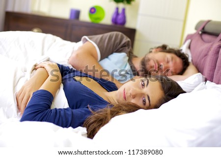 Bad relationship young woman depressed about sleeping boyfriend