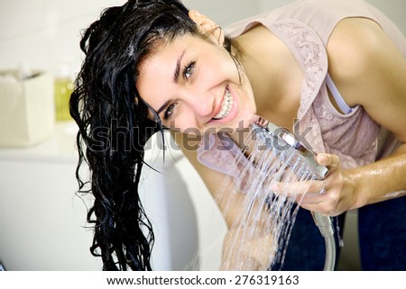 Woman looking camera with wet long hair
