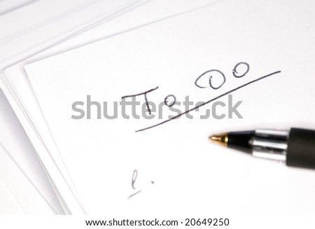 Closeup image of black pen on notebook
