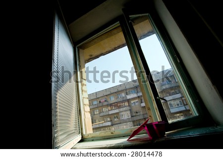 An image of an open window with blinds