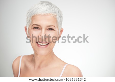 Similar – Image, Stock Photo Senior woman with face mask looking out of window at home