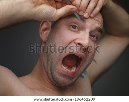 Young men pluck his eyebrows.