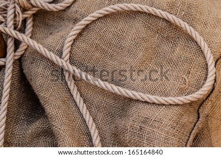 an old hemp rope on a brown jute sack