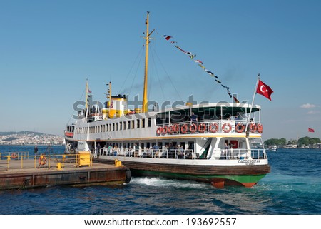 ISTANBUL - MAY 19: People get on board the ship at Karakoy Pier on May 19, 2014 in Istanbul. Nearly 150,000 passengers use ferries daily in Istanbul, due to easy access to two different continents.