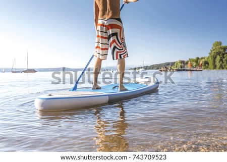 Similar – Image, Stock Photo Paddling on the Chiemsee