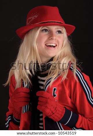 A pretty blond girl wearing red clothes, black background.