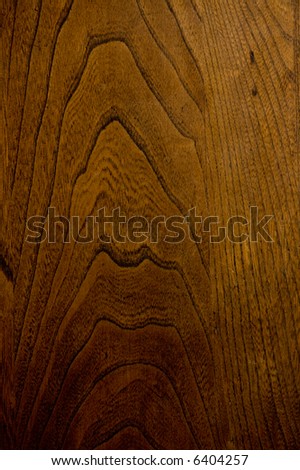 Closeup of dark stained oak wood grain - rough and worn.