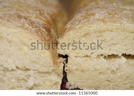 Four halves of fresh italian bread divided