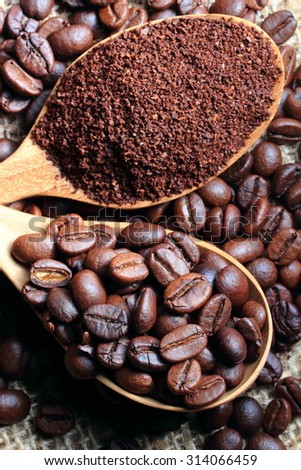 roasted coffee beans.Arabic roasting coffee - ingredient of hot beverage.Closeup of coffee beans at roasted coffee heap.Still Life  of coffee beans