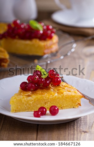 Gluten free cornmeal cake served with red currant