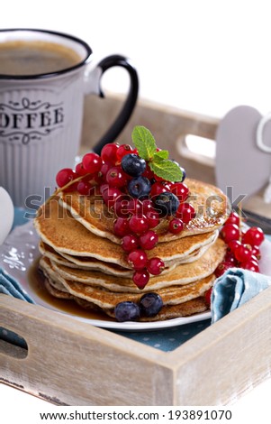 Vegan pancakes with mixed berries for breakfast isolated