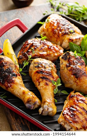 Grilled chicken thighs and drumsticks with sweet honey glaze Stock fotó © 