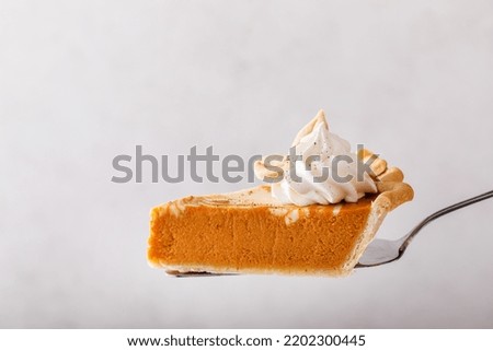 Image, Stock Photo Slice of pumpkin pie on a dish