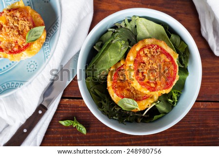 Macaroni and cheese in muffin tins with tomatoes