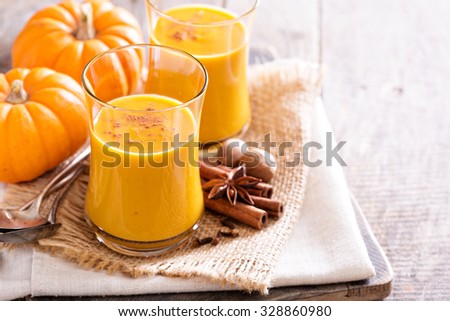 Pumpkin and orange spiced fall drink with cinnamon