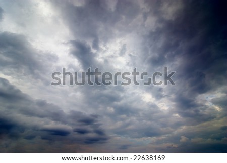 stormy weather with dark clouds in the dramatic sky