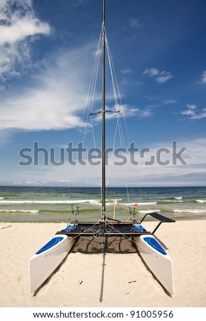 Catamaran on the beach before set out  on a journey. Polish seaside.