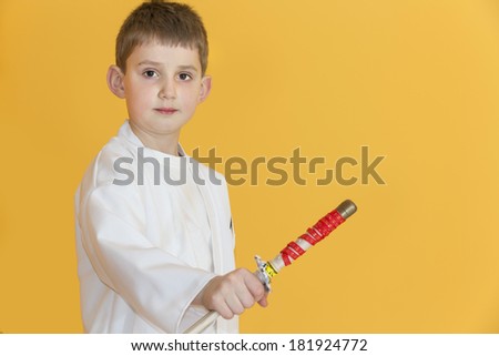 Boy age 7 fighting like karate player