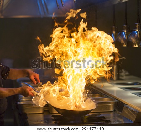 Chef cooking with flame