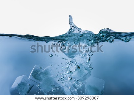 Blue liquid with bubbles and ice cubes in on white