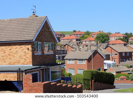 English housing estate with blue sky background.