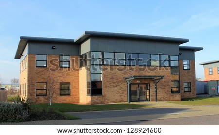 Exterior of empty modern office building to let on business park.