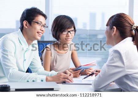 Experienced business consultant having a meeting with young and promising team