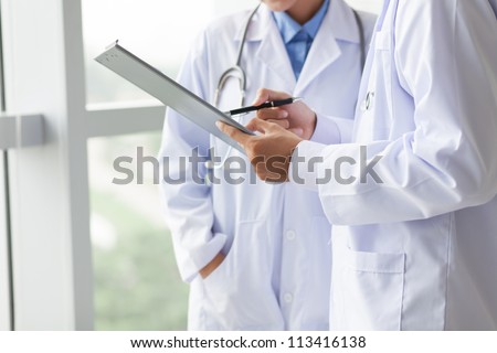 Similar – Image, Stock Photo Unrecognizable male doctor giving anesthesia to patient lying on couch before surgery